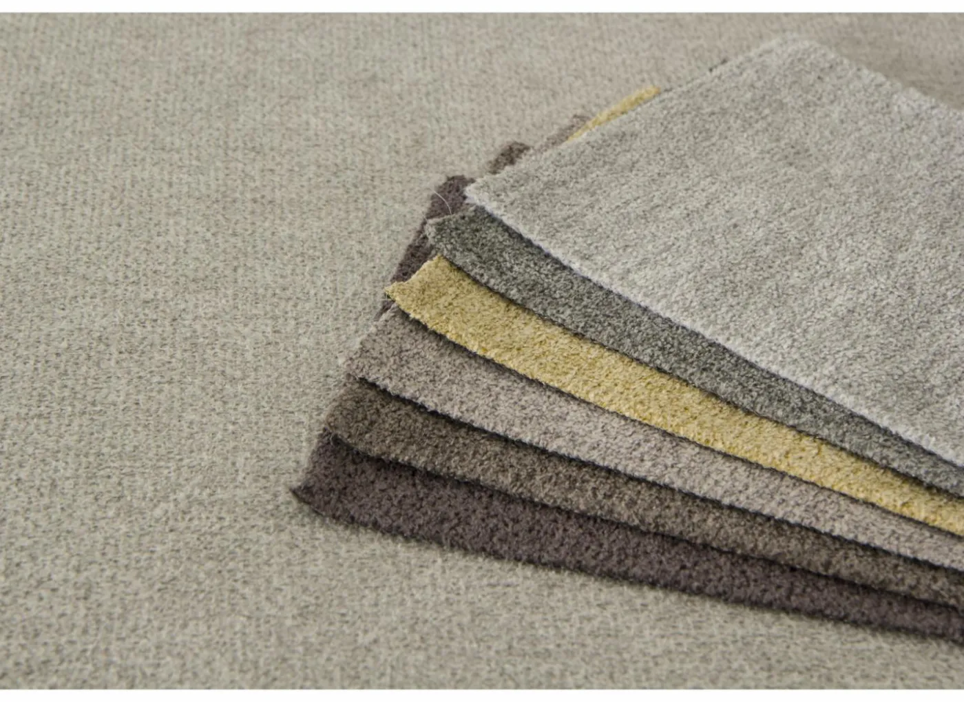Hoeksalon Alcamo 331x184cm - stof - grijs met poef